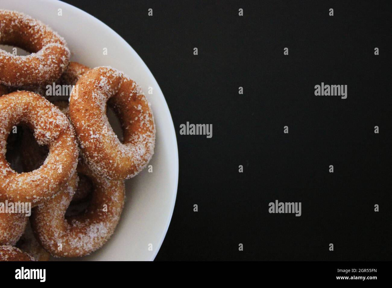High Angle View Of Donuts In Plate On Table Stock Photo
