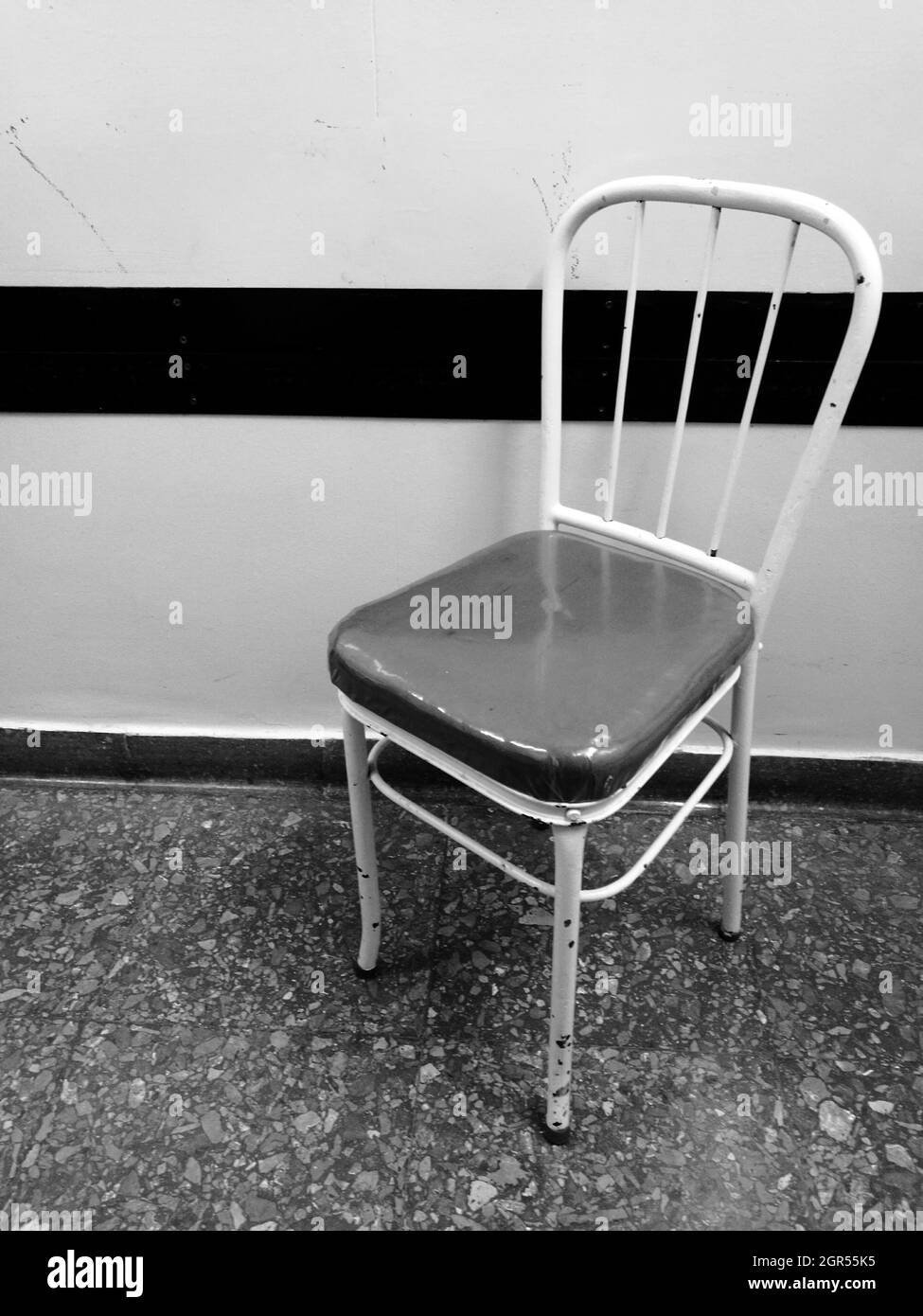 Empty Chair Against Wall At Home Stock Photo Alamy