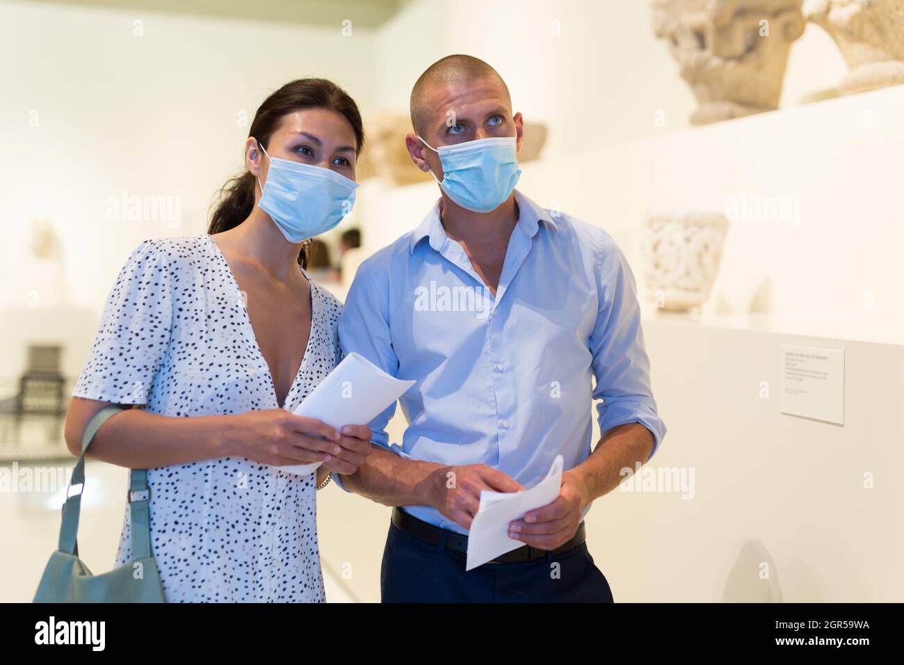 Man and woman in gallery Stock Photo - Alamy