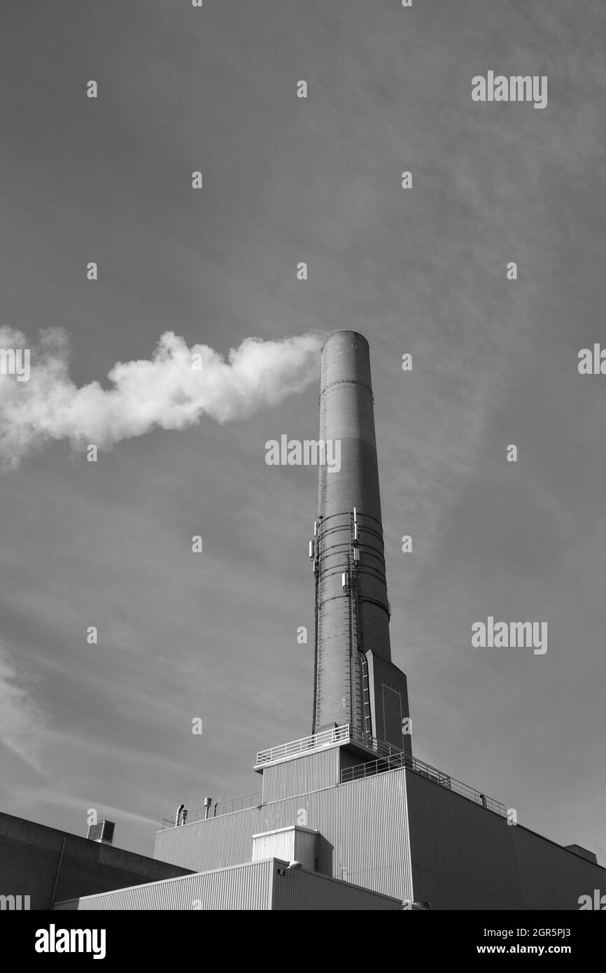 Low Angle View Of Smoke Emitting From Factory Against Sky Stock Photo