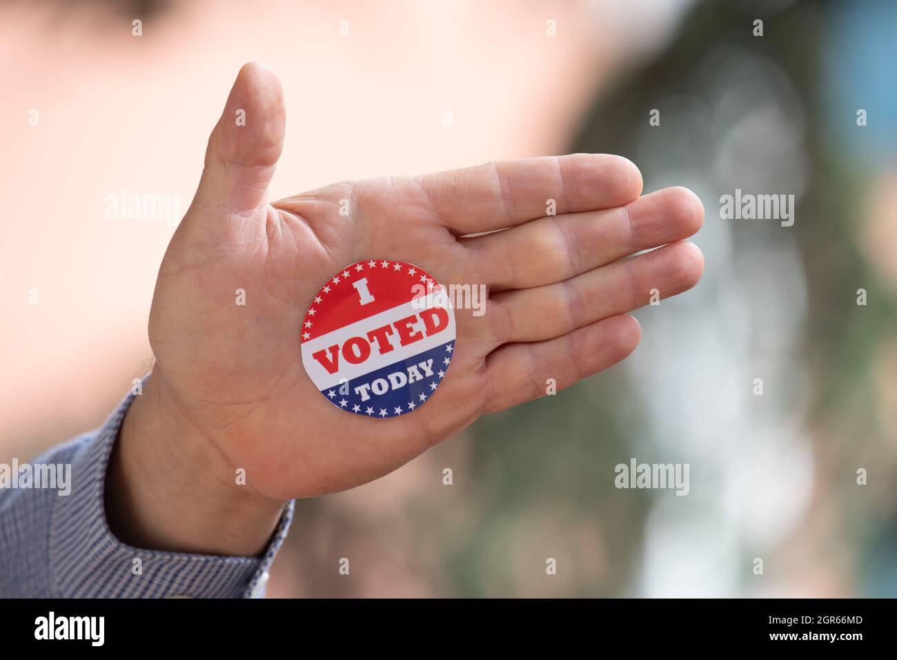 Cropped Hand Of Man With Voting Stamp Stock Photo