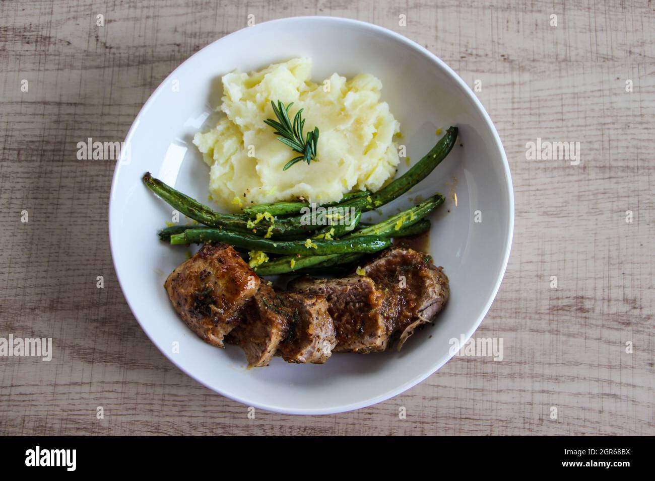 Comfort Food Mashed Potatoes Green Beans And Pork Chop Stock Photo