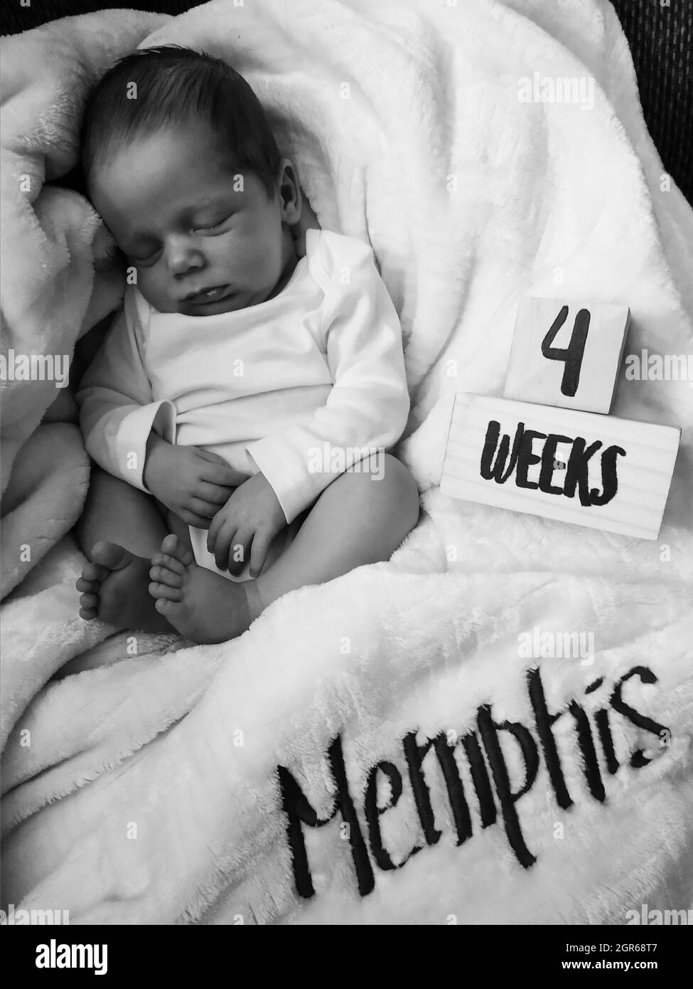 Black baby sleeping on bed Black and White Stock Photos & Images - Alamy