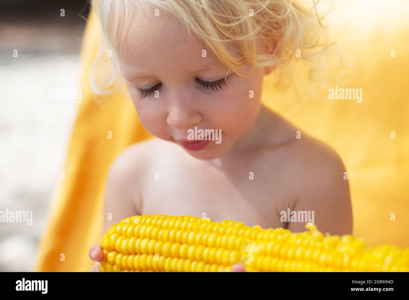 Girl 2 3 eating sweet corn hires stock photography and images Alamy