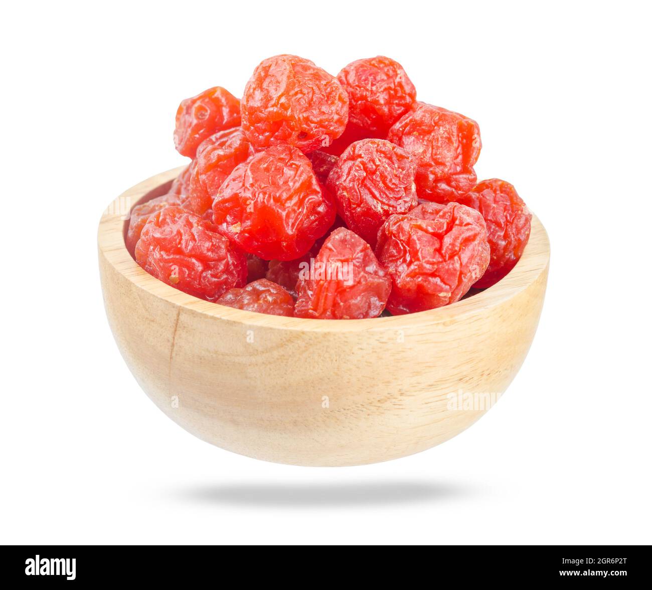Dried red prunes fruits (Preserved fruits Chinese plum) in wooden bowl
