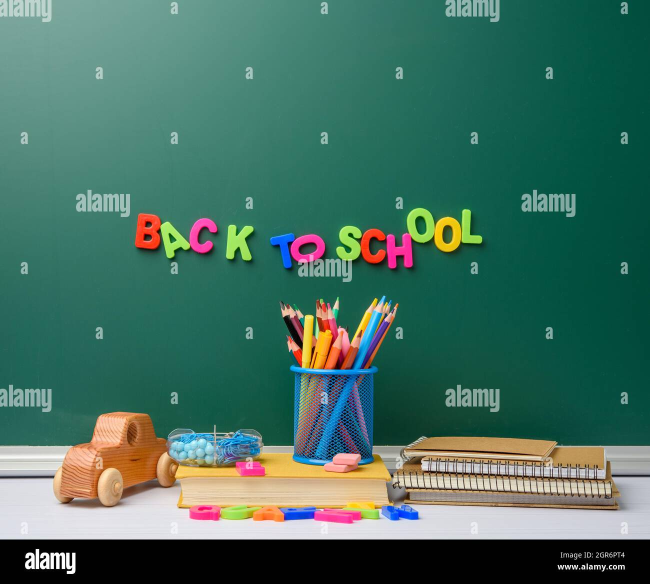 Stack Of Books And Stationery On Empty Chalk Green Chalkboard Background, Back To School Stock Photo - Alamy Stack Of Books And Stationery On Empty Chalk Green Chalkboard Background, Back To School Stock Photo - Alamy