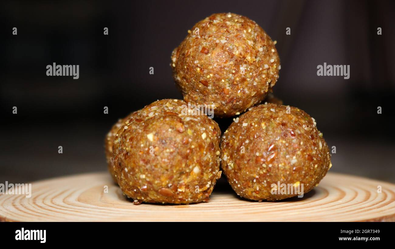 These nutritious balls are easy to make & healthy to eat. These nutritious balls are the best option for sweet cravings. Stock Photo