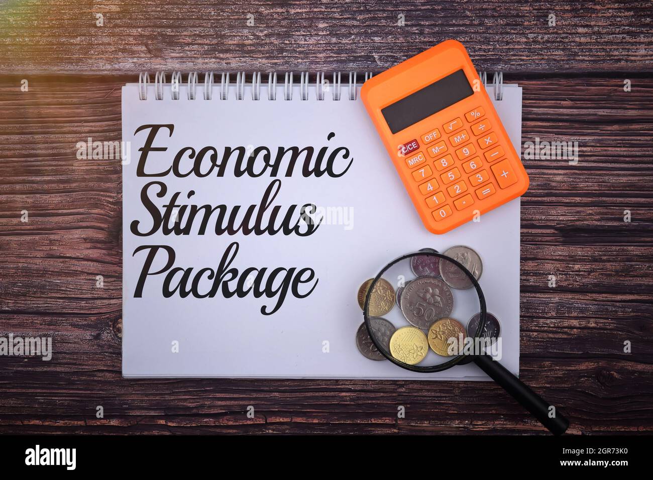 Economic Stimulus Package Wording On A Wooden Background. Business And Economy Concept Stock Photo
