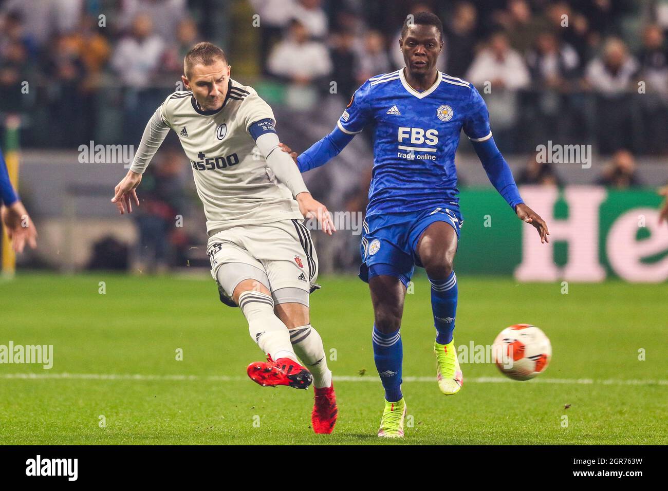 Warsaw, Poland. 30th Sep, 2021. Artur Jedrzejczyk (L) of Legia vies with Patson Daka of Leicester during the Europa League Group C football match between Legia Warsaw and Leicester City in Warsaw, Poland, Sept. 30, 2021. Credit: Adam Starszynski/Xinhua/Alamy Live News Stock Photo