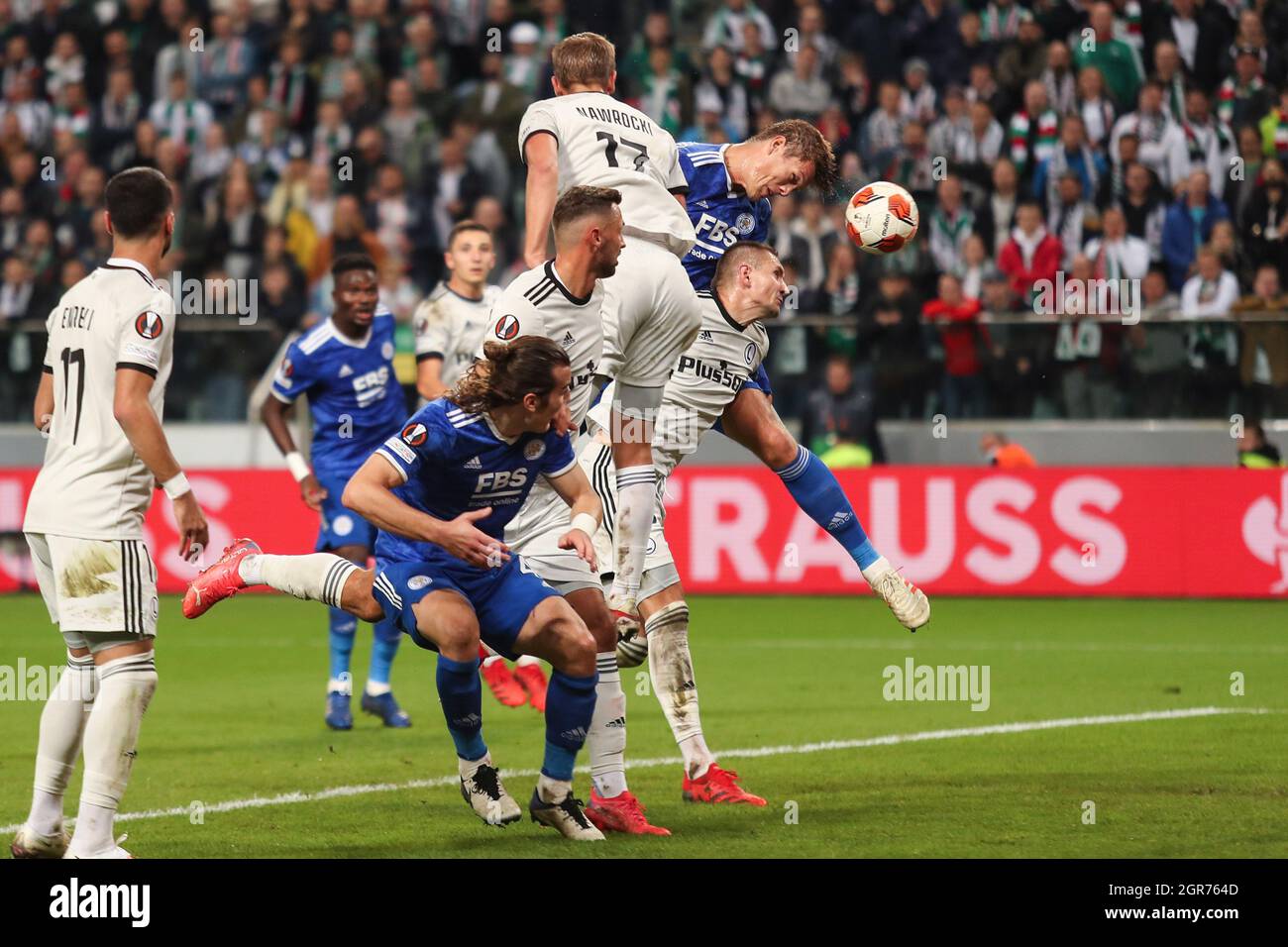 Warsaw, Poland. 30th Sep, 2021. Jannik Vastergaard (R, top) of Leicester wins a header with Artur Jedrzejczyk of Legia during the Europa League Group C football match between Legia Warsaw and Leicester City in Warsaw, Poland, Sept. 30, 2021. Credit: Adam Starszynski/Xinhua/Alamy Live News Stock Photo