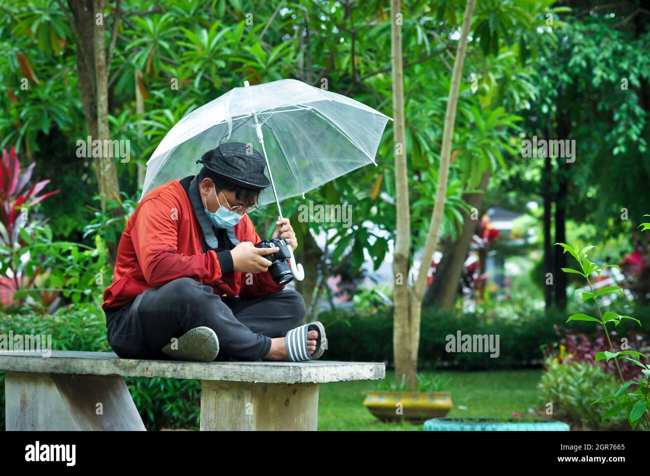 Man Holding Umbrella In Rainy Season Stock Photo Alamy