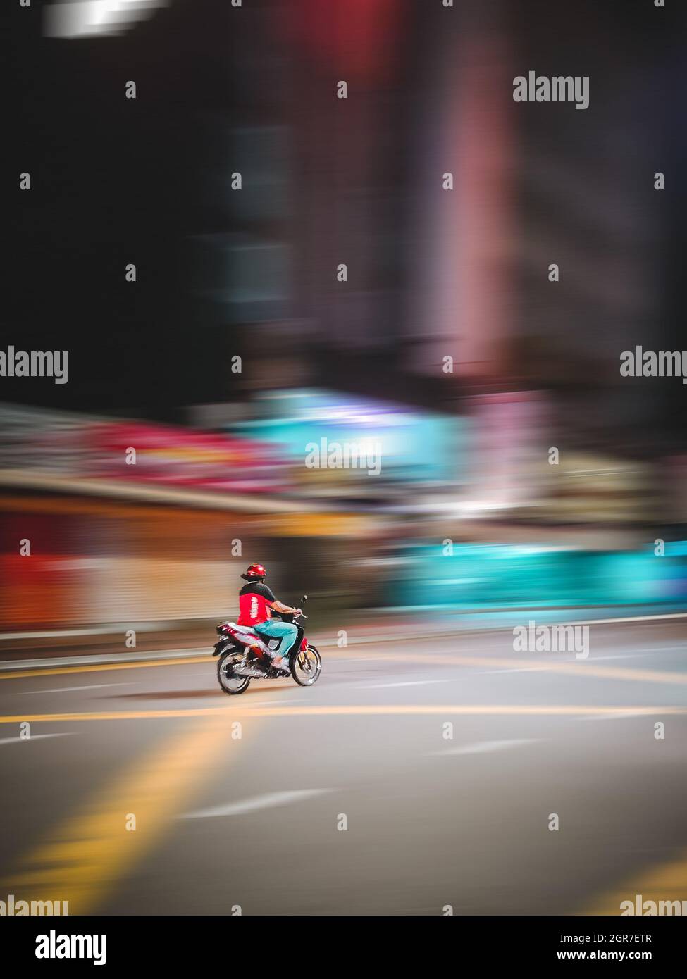 Blurred motion person riding motorcycle city street night hi-res stock ...