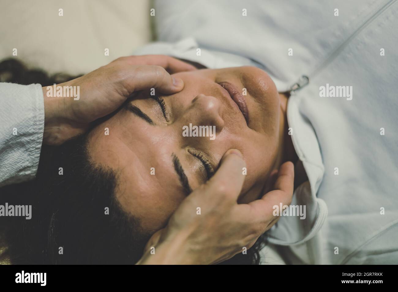 Therapist Man Doing A Shiatsu Massage To A Woman. Holistic Therapy