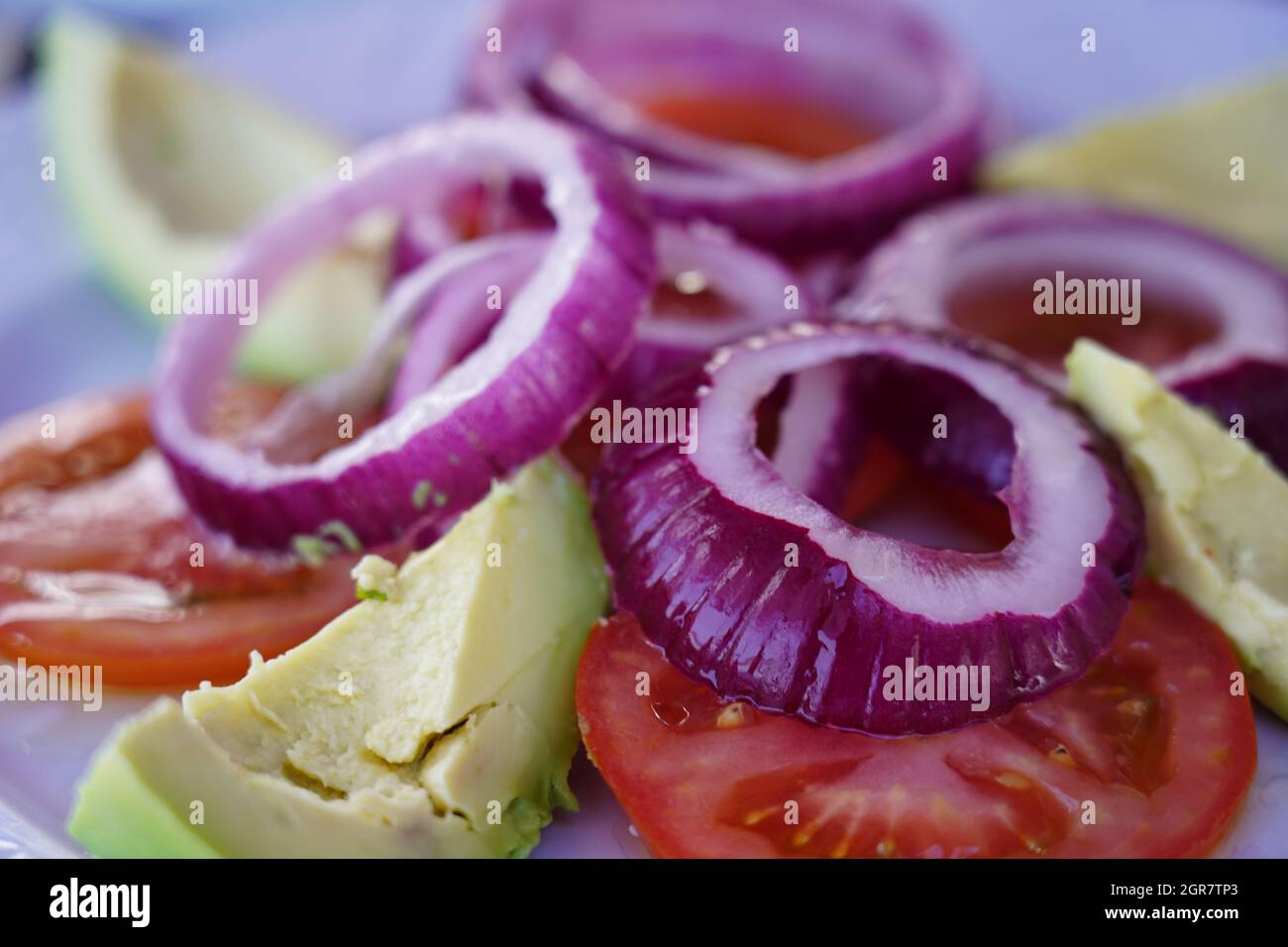Raw Vegan Salad Of Fresh Onion Rings, Tomatoe And Avocado Slices, Tenerife, Canary Islands Stock Photo