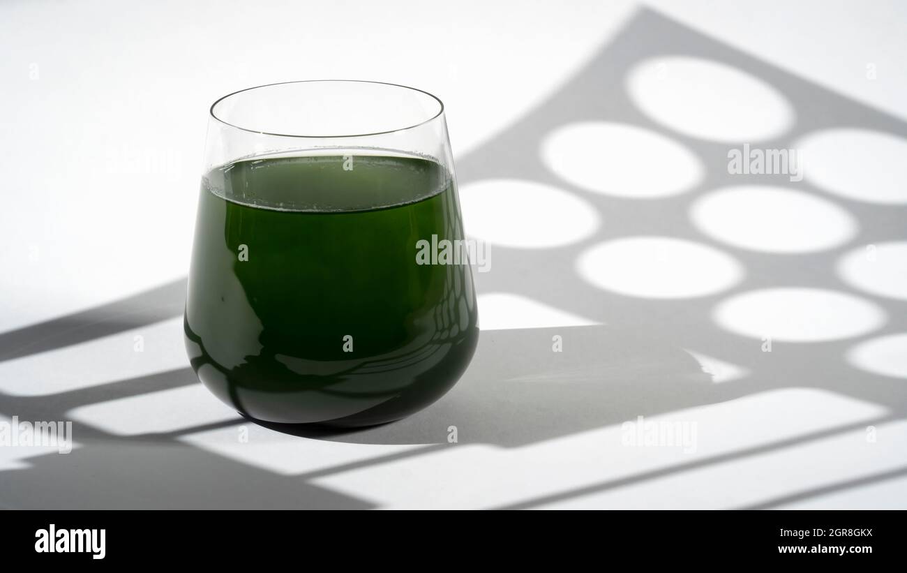 Healthy Spirulina Chlorella Drink In The Glass, Hard Light With Shadows