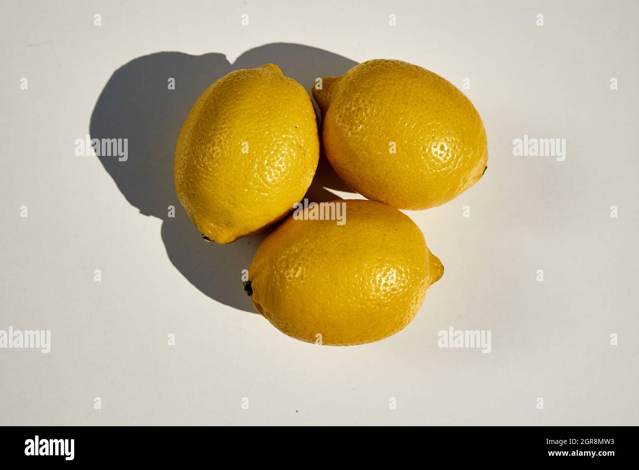 Shot from the top of three lemons  isolated on white Stock Photo
