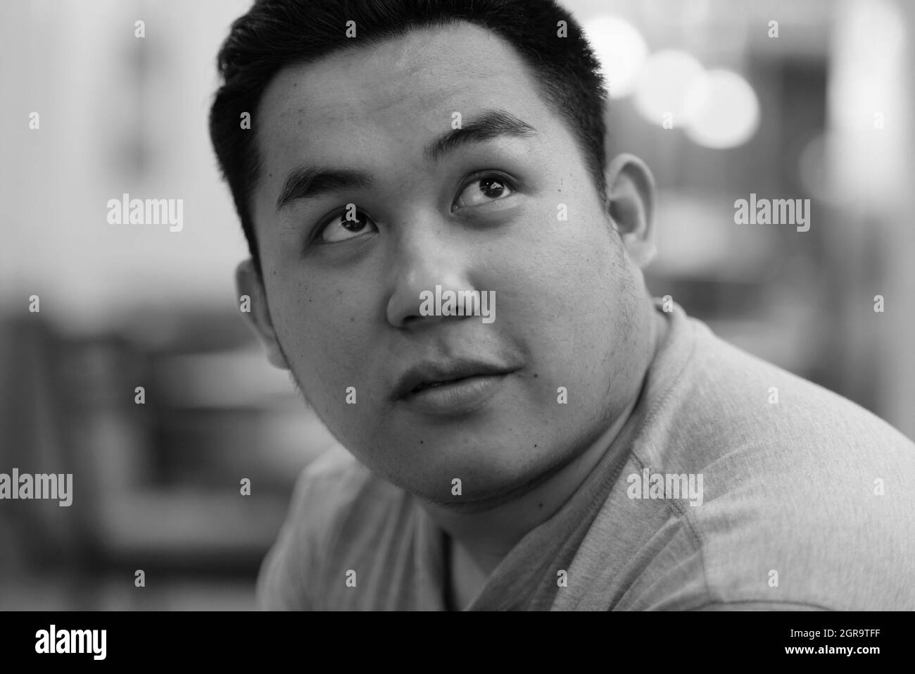 Asian man serious looking at camera Black and White Stock Photos ...