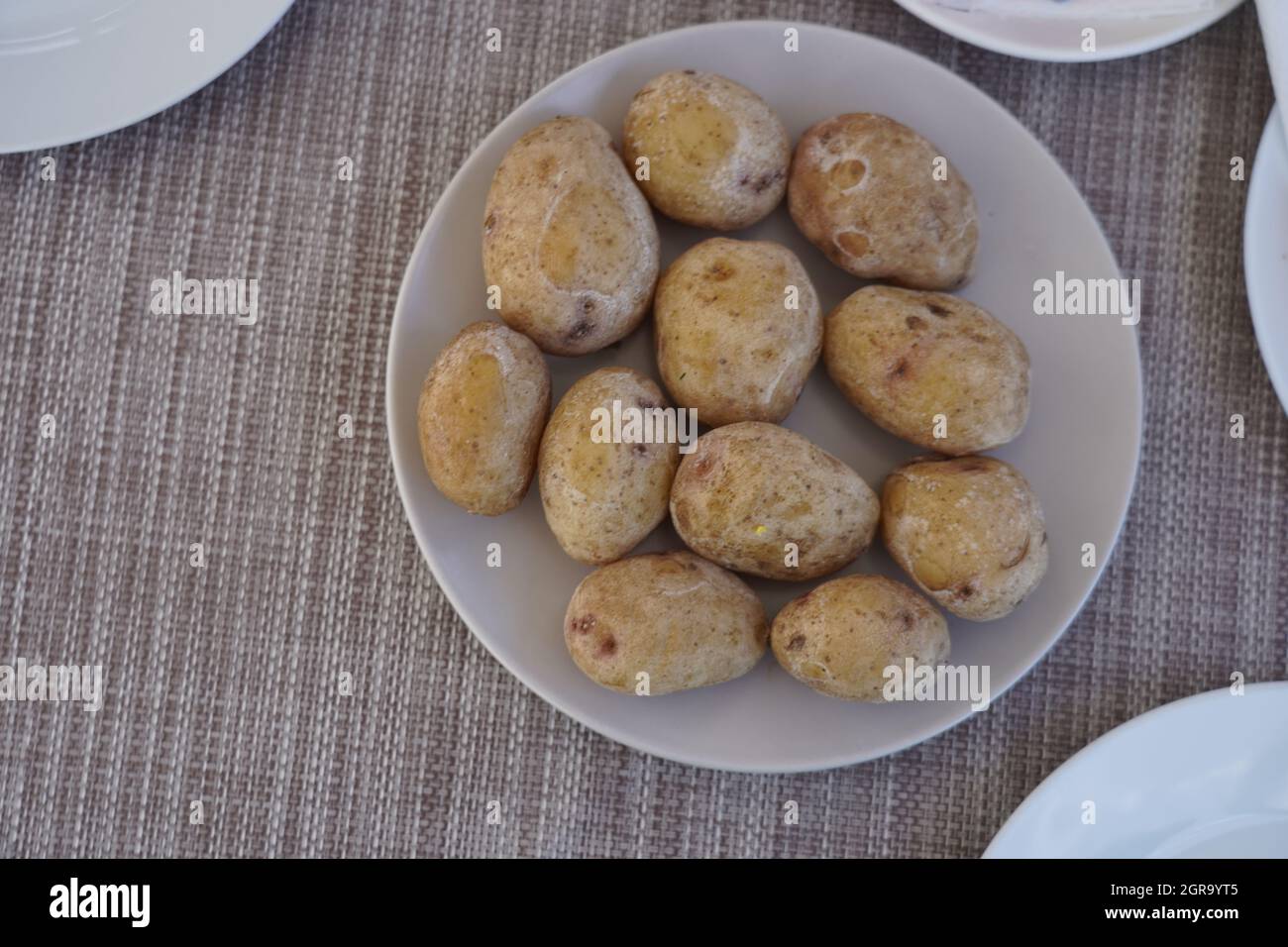 Cooked Potatoes Served On Plate Stock Photo