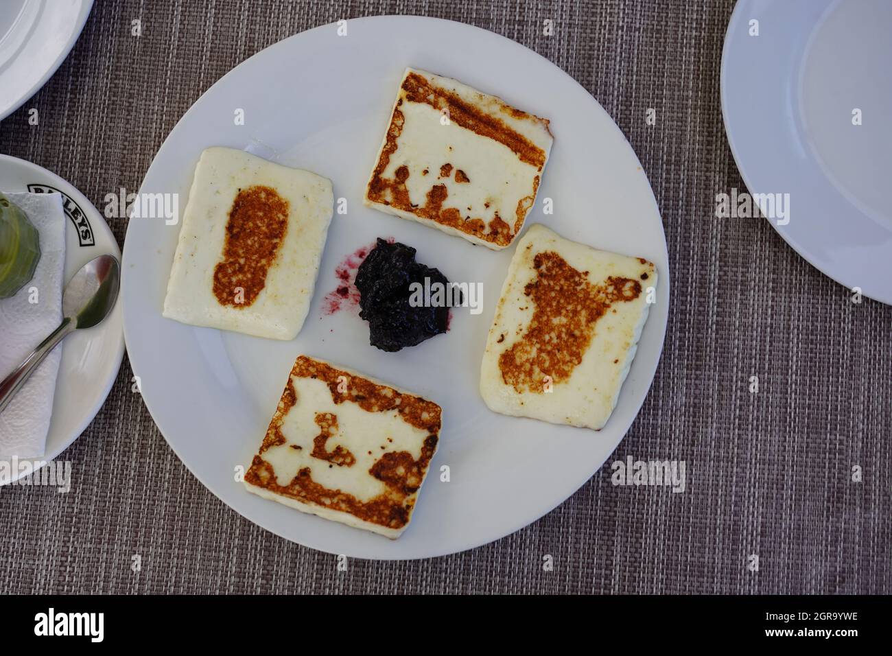 High Angle View Of Grilled Goat Cheese With Stewed Cranberries Served, Tenerife, Canary Islands Stock Photo