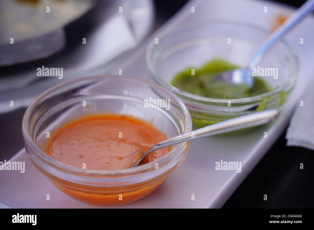 High Angle View Of Spicy Dip Sauces In Glass Bowls On Table, Tenerife Stock Photo
