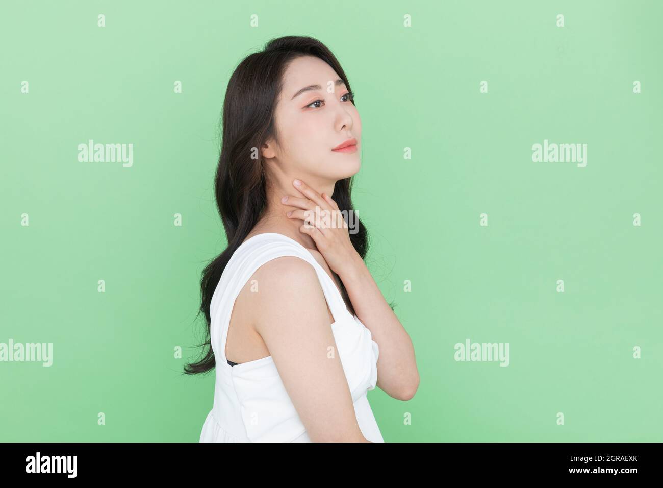 beauty concept, beautiful Korean Asian woman touching neck Stock Photo ...