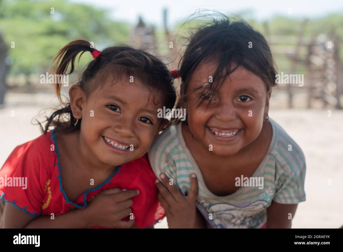Mayapo, Colombia. 26th Sep, 2021. Two Wayuu indigenous community childs pose for a photo during a Humanitarian Mission developed by 'De Corazon Guajira' in Mayapo at La Guajira - Colombia were they visited the Wayuu indigenous communities 'Pactalia, Poromana, Perrohuila' on September 26, 2021. The Guajira region in Colombia is the poorest region in Colombia, with its people commongly living without drinkable water, electricity and food. Credit: Long Visual Press/Alamy Live News Stock Photo