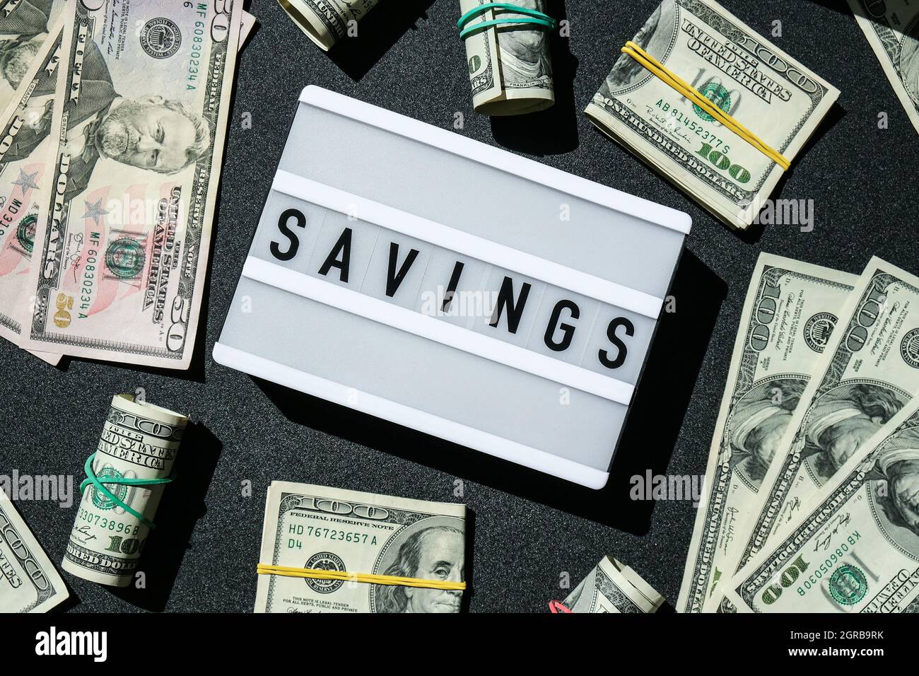 Lightbox board with the word MONEY in black letters around Us dollar  banknotes. Finance background. Business, financial success and making money  Stock Photo - Alamy
