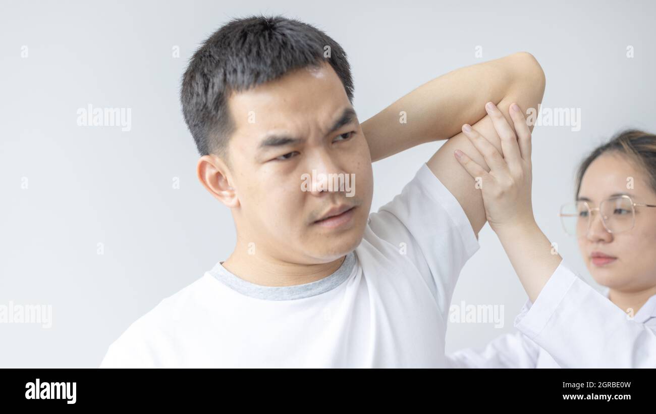 Physical Therapy, Female Physiotherapist Treats Arms And Shoulders Pain