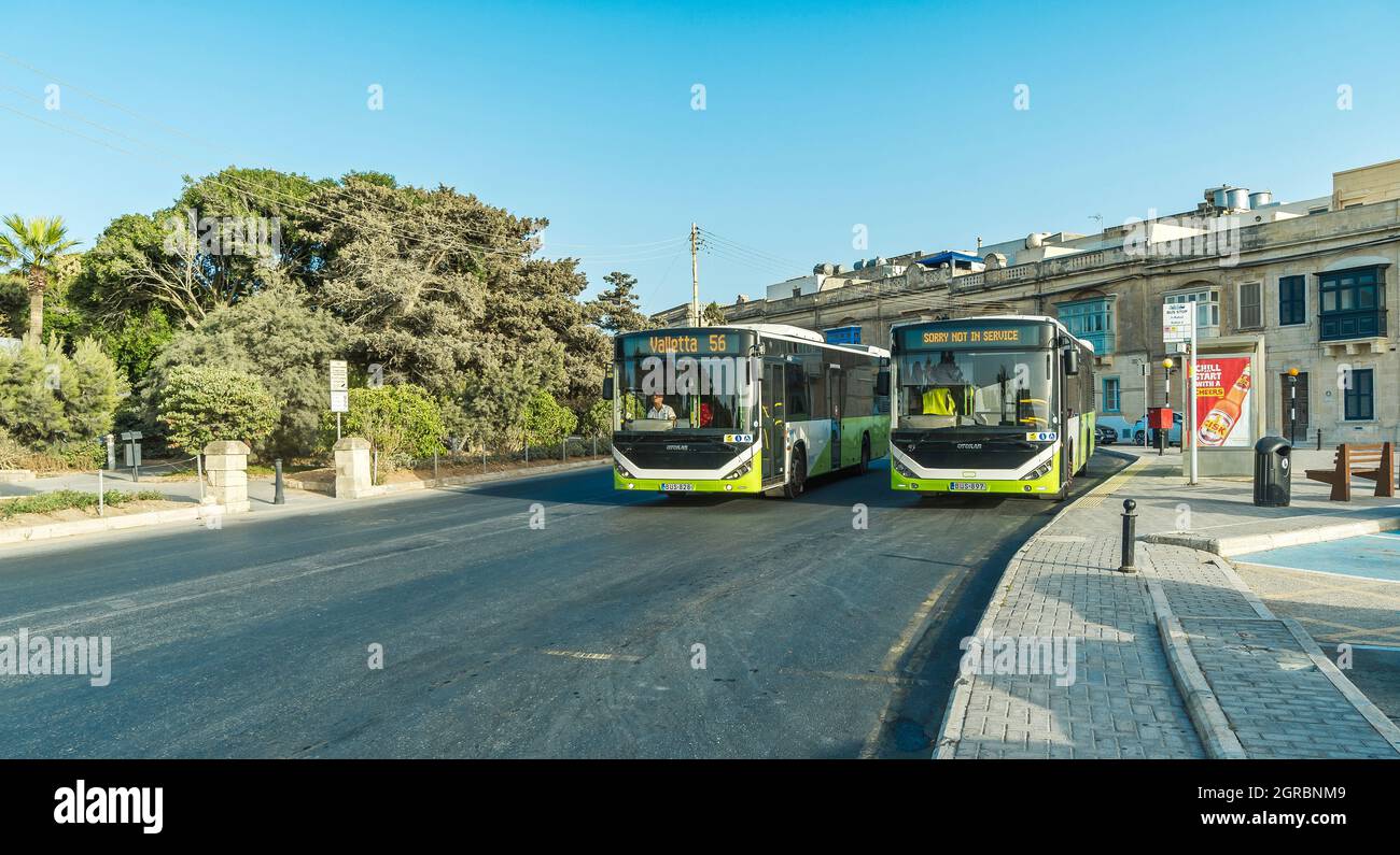 Buses on the street of one of the small Maltese towns - Rabat, Malta. Stock Photo
