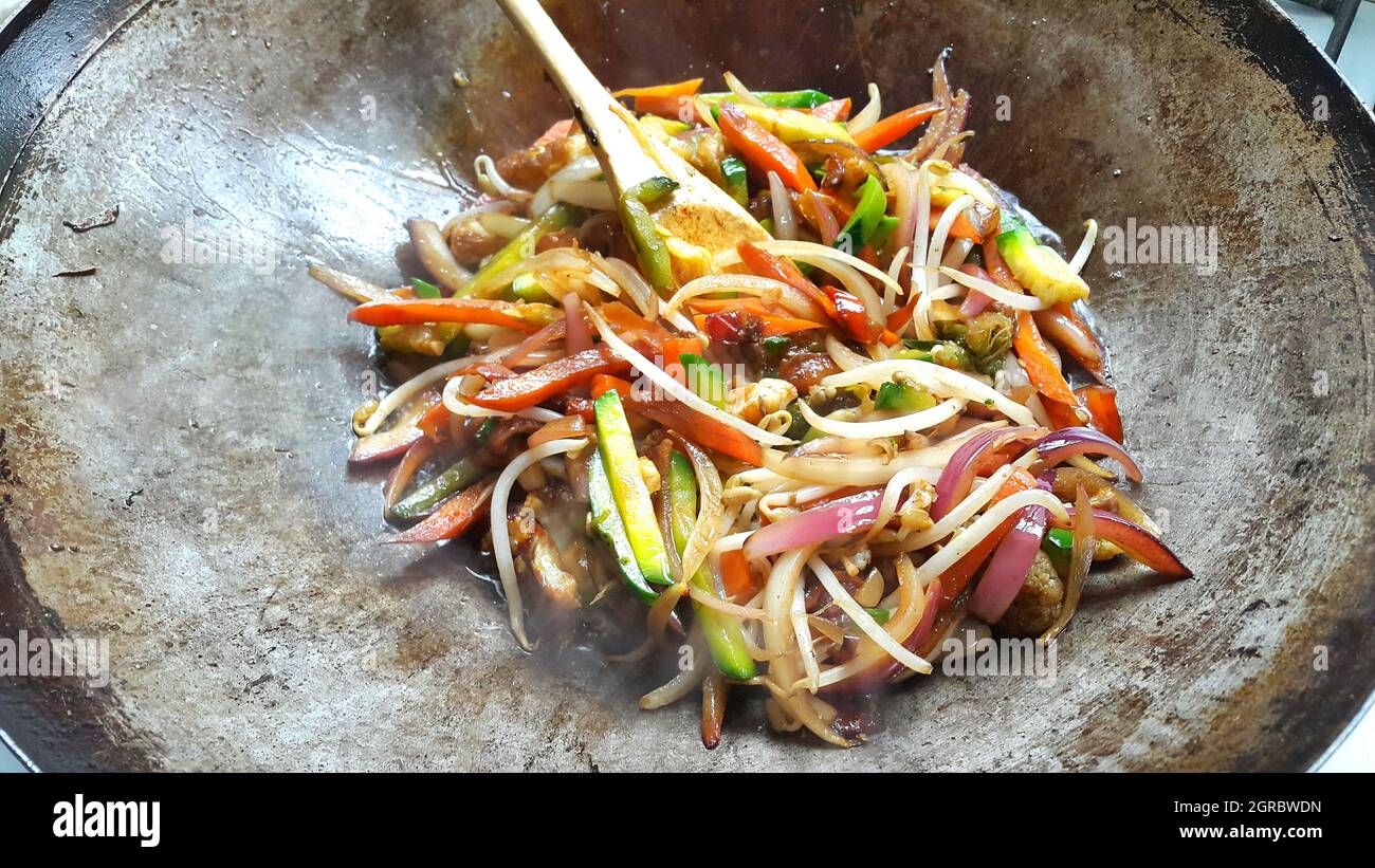 Close-up Of Wok With Grilled Vegetables Stock Photo