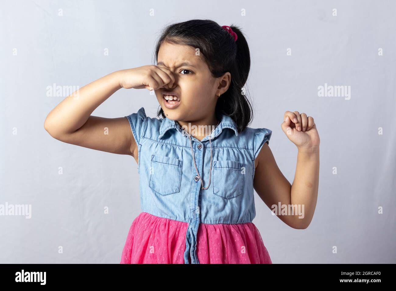 A Pretty Cute Indian Girl Child Shows Bad Smell Holding Her Nose Isolated On White Background Stock Photo - Alamy A Pretty Cute Indian Girl Child Shows Bad Smell Holding Her Nose Isolated On White Background Stock Photo - Alamy