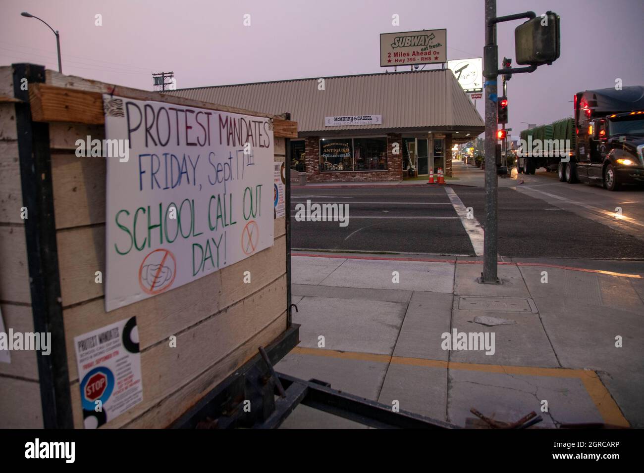 These signs are advertising a student walkout at a local school in Bishop, Inyo County, CA, USA due to Covid-19 vaccination mandates Stock Photo