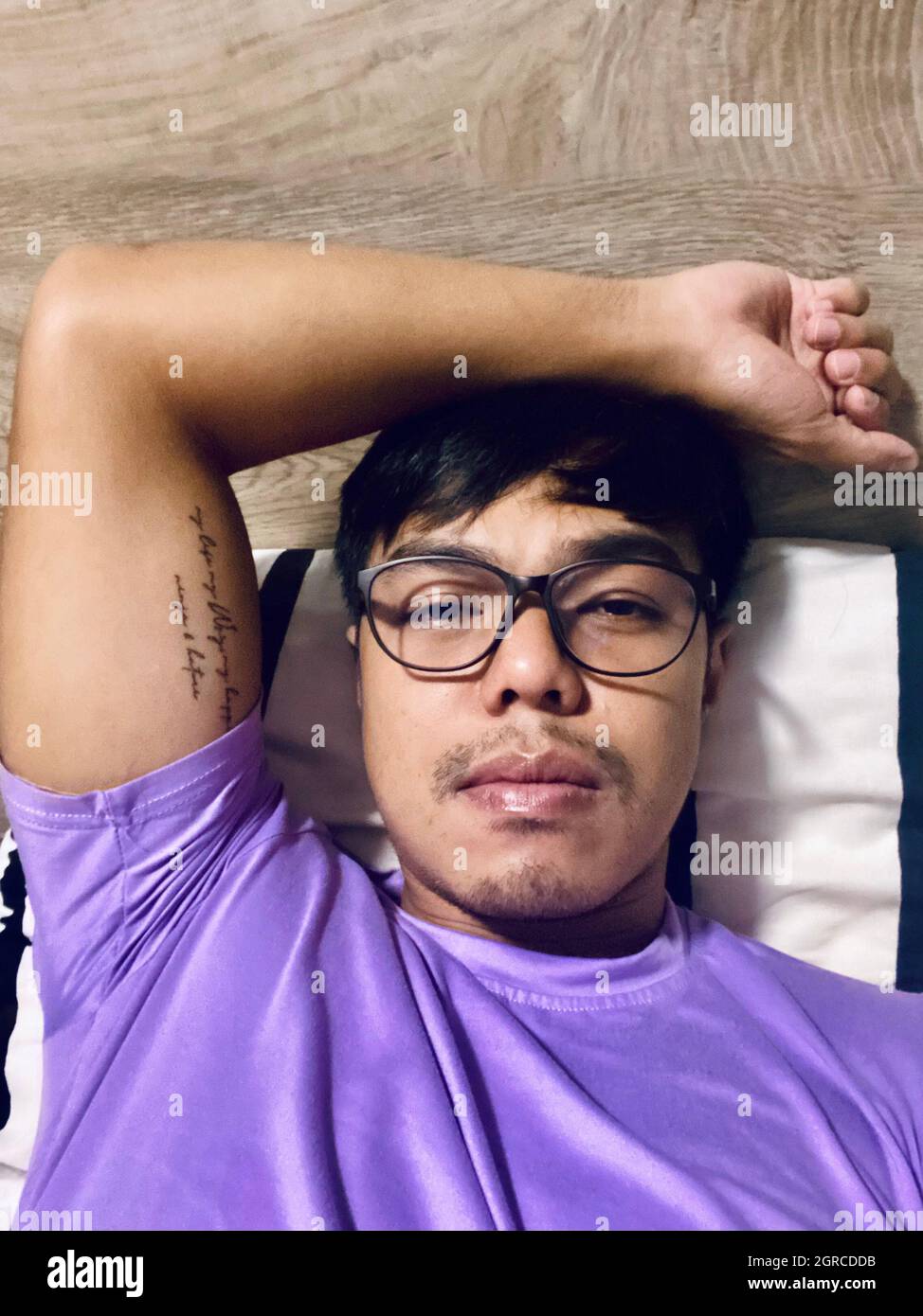 Portrait Of Young Man Lying Down Stock Photo Alamy