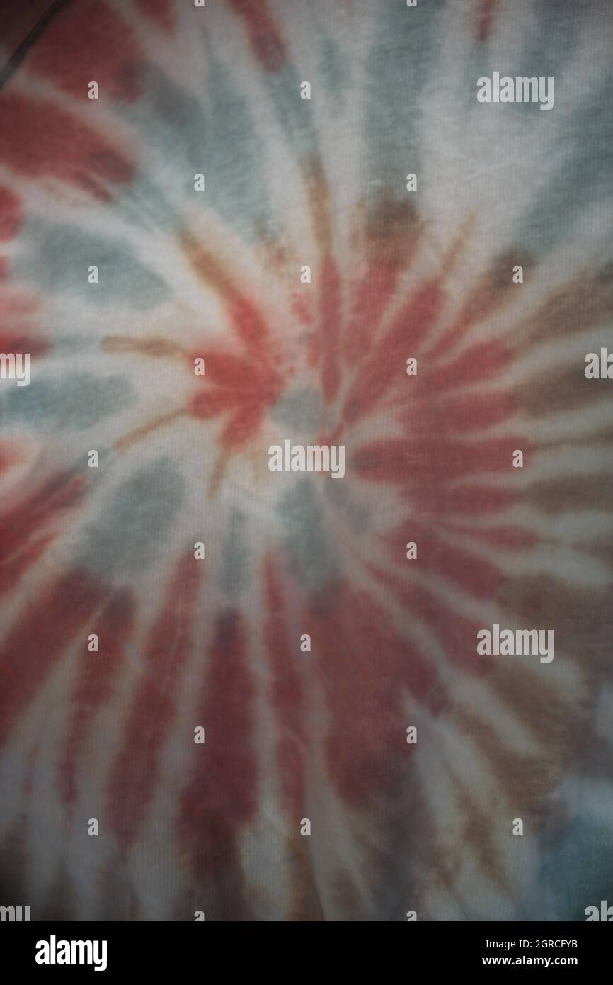 tie dye vivid colourful rainbow background swirl with copy space Stock