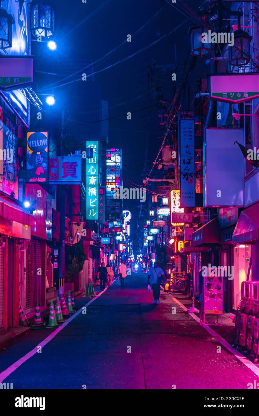The view of Dotonbori street at night in Osaka-Kobe Japan with the cyberpunk color style. Cyberpunk color for night street photography. Stock Photo