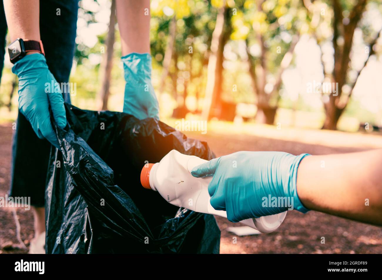 Volunteer Holding Plastic Garbage Clean To Dispose Of Waste Properly. Stock Photo