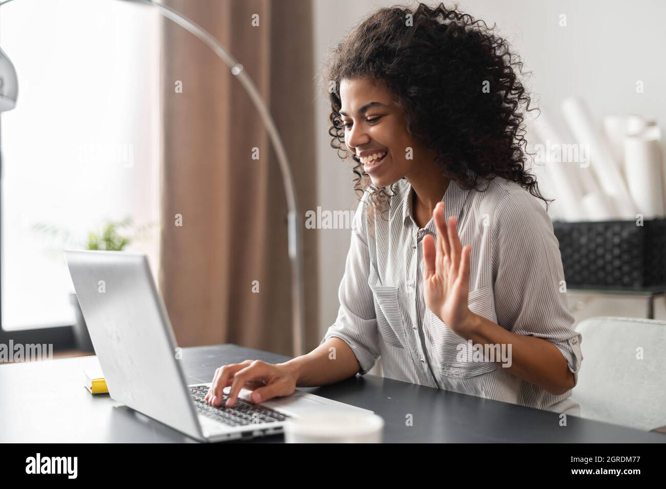 Confident businesswoman sitting at desk, making conference video call on  laptop web cam, female manager selling a product or services, having online  distance network chat job interview, waving Stock Photo - Alamy