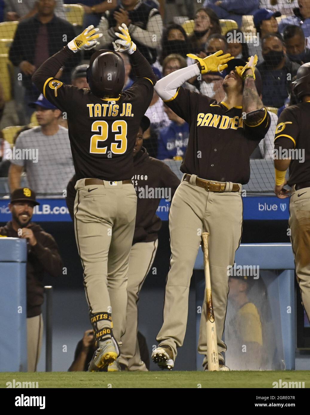 Los Angeles, USA. 01st Oct, 2021. San Diego Padres' Fernando Tatis Jr. (23) celebrates with teammate Manny Machado (R) after hitting a 457-foot, two-run blast off Los Angeles Dodgers' starting pitcher Tony Gonsolin during the fifth inning at Dodger Stadium in Los Angeles on Thursday, September 30, 2021. The blast bounced off the top of the roof over the left field pavilion and out of the stadium. It was Tatis' NL-leading 42nd and seventh at Dodger Stadium this season. Photo by Jim Ruymen/UPI Credit: UPI/Alamy Live News Stock Photo