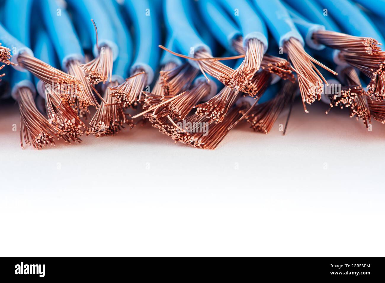 Copper electrical cable wire scrap closeup on white background Stock