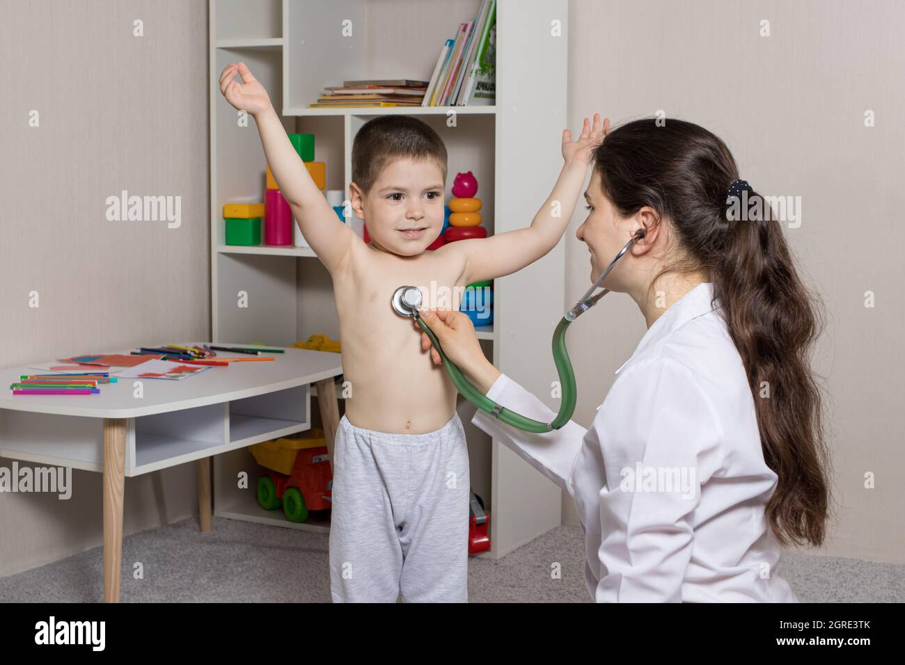 Pediatric examination of a child with a stethoscope. Little boy and pediatrician Stock Photo Alamy