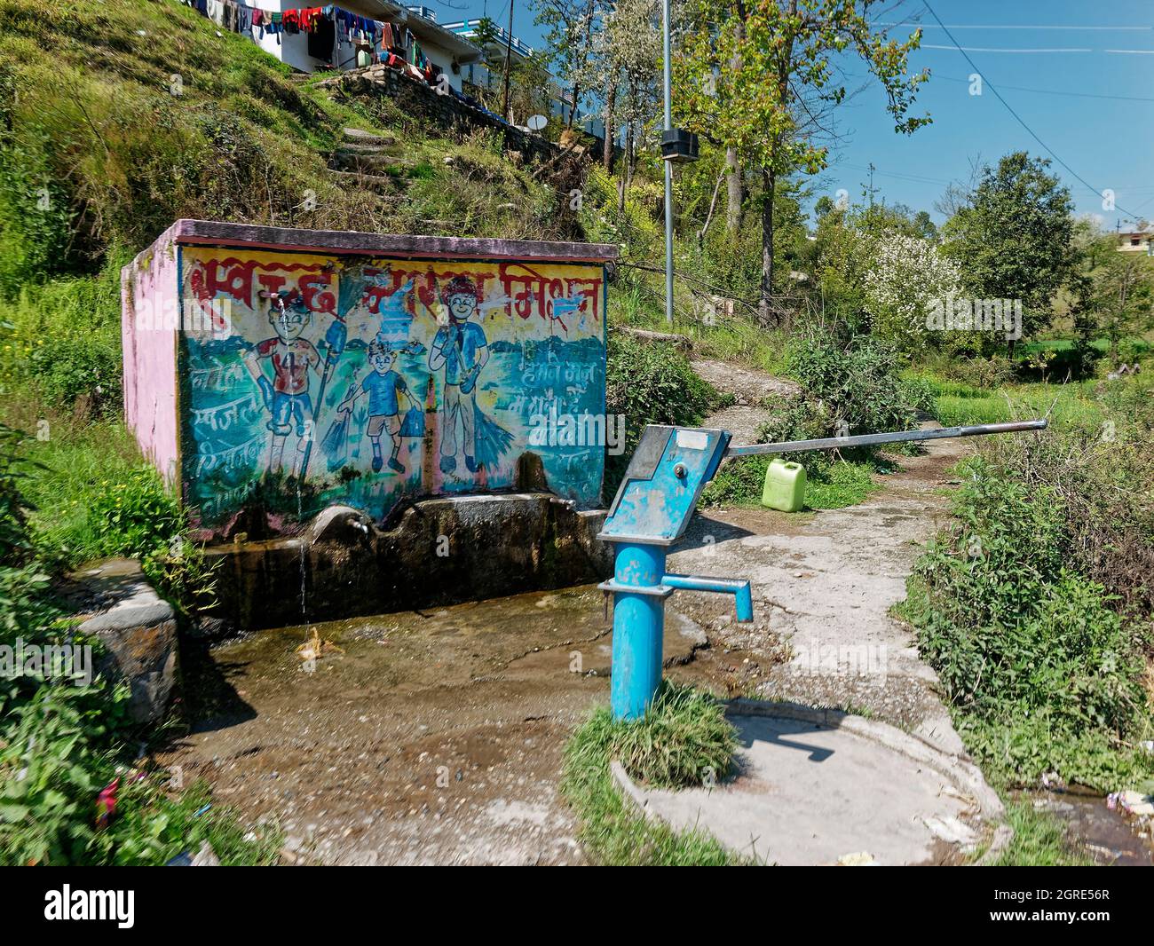 Drink water from tub well in Himalayan village Stock Photo Alamy