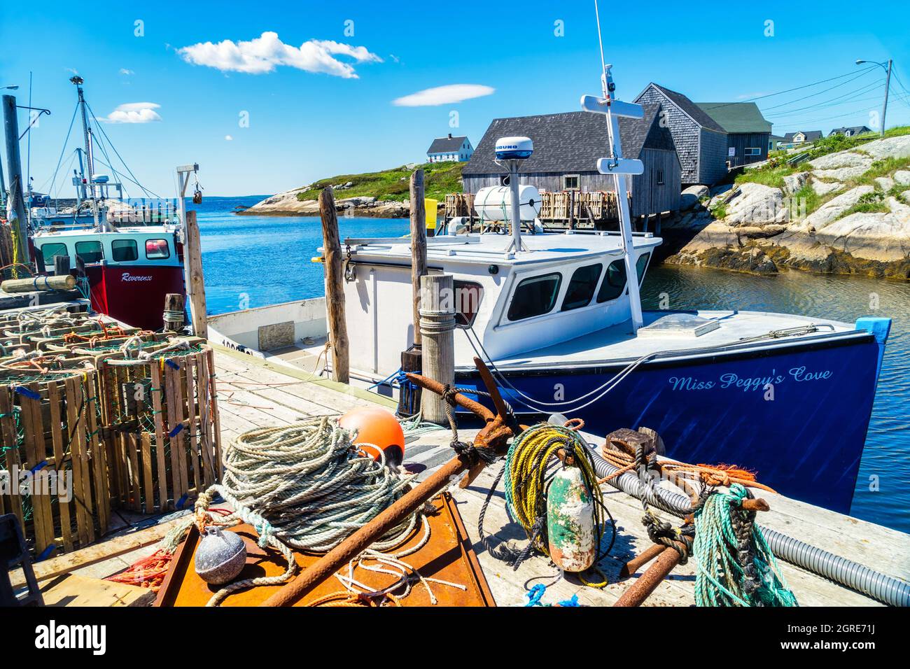 Fishing boat 'Miss Peggy's Cove' tied up at the wharf in Peggy's Cove, Nova Scotia, Canada. Stock Photo