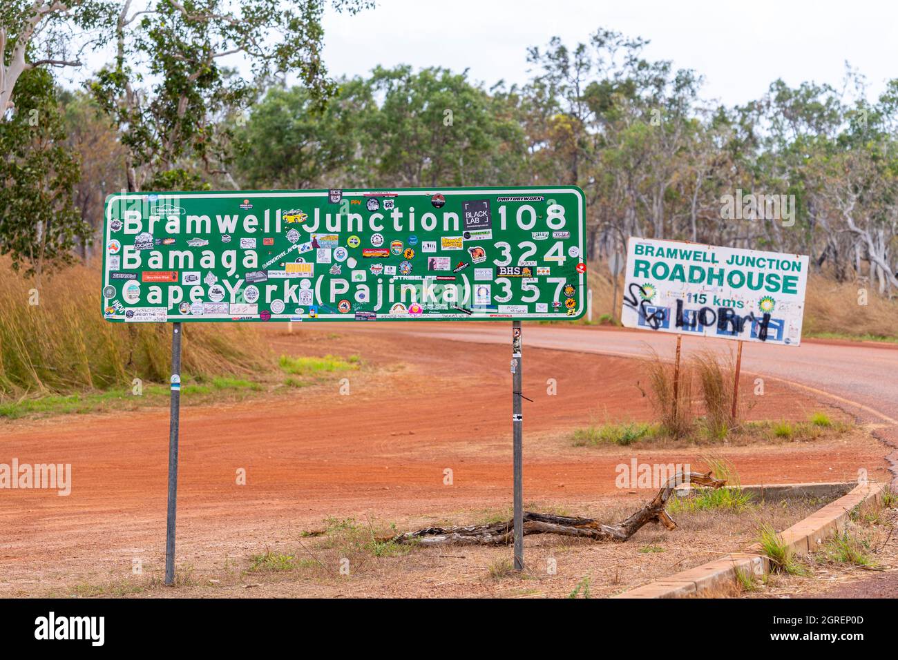 Roadside signs covered in stickers and graffiti, Peninsula Development