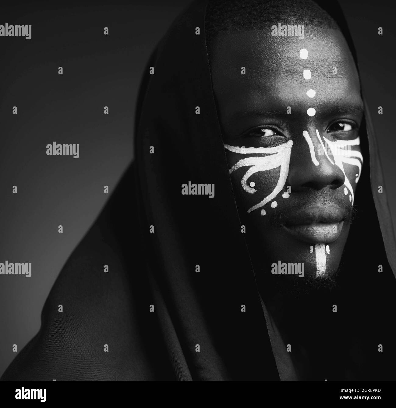 Portrait Of A Black Man With White Tribal Face Painting Stock Photo Alamy