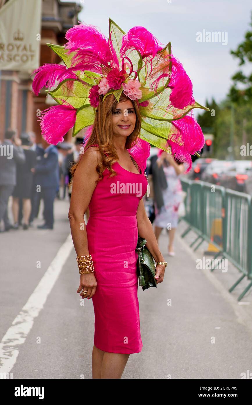 Inez Hernandez wears a glamorous feathered hat combined with a pink dress on Ladies Day Stock Photo