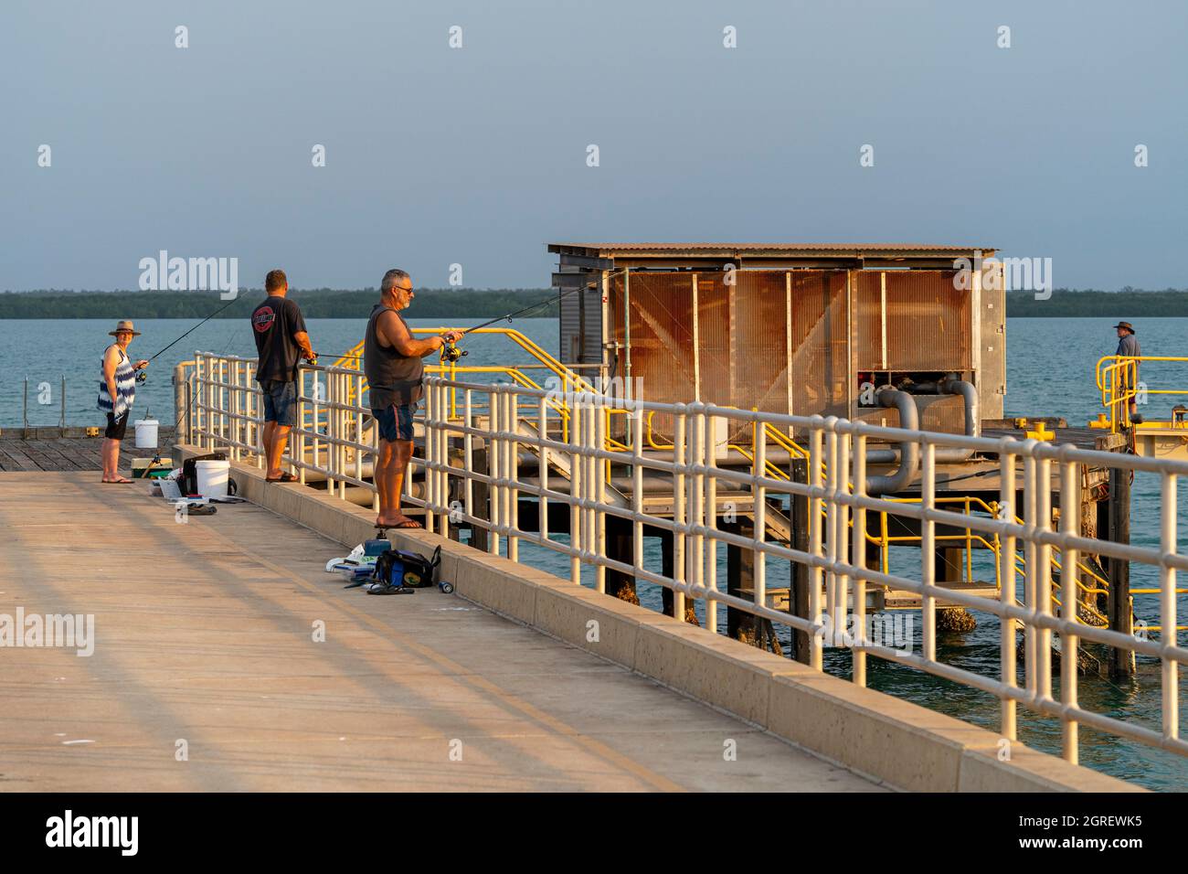 3 people fishing on Evan's Head refueling jetty, Weipa, Cape York