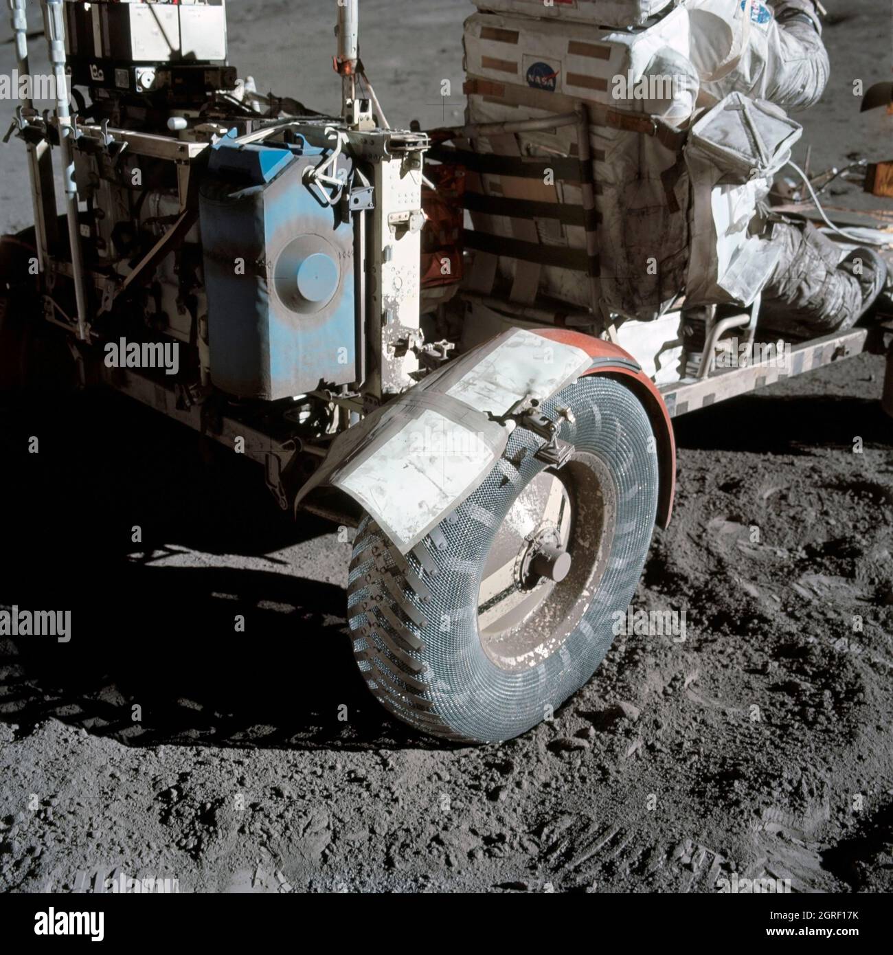 This photograph taken during the Apollo 17 mission (the last mission of the  Apollo Program), depicts stiff plasticized maps being taped together and  fastened by clamps to patch a broken fender of