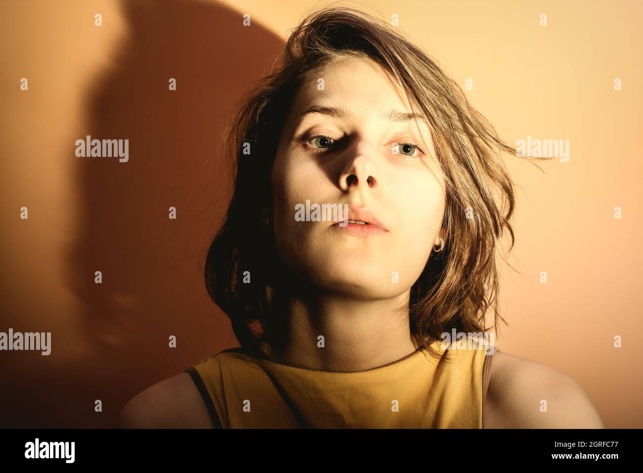 Portrait Of A Young Woman With Overexposure. Head Thrown Back Stock