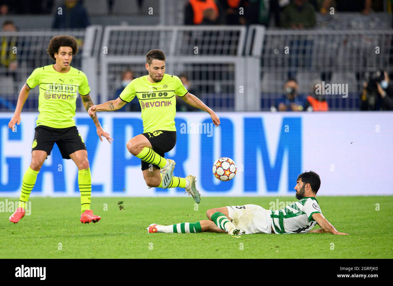 Dortmund, Deutschland. 28th Sep, 2021. left to right Axel WITSEL (DO), Raphael GUERREIRO (DO), Luis NETO (LIS), action, football Champions League, preliminary round 2nd matchday, Borussia Dortmund (DO) - Sporting Lisbon (LIS) 1: 0, on 28.09. 2021 in Dortmund/Germany. Â Credit: dpa/Alamy Live News Stock Photo