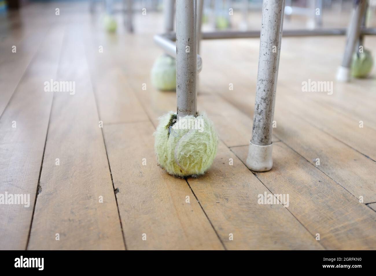 Tennis Balls On Student Desk Legs In Empty Classroom, Naoshima, Japan